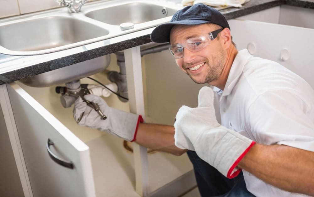 a plumber working for fixing sink