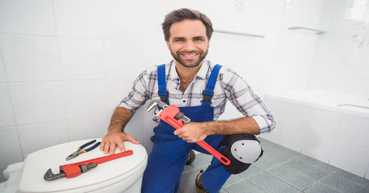 plumber working for toilet installation in Hamilton, Ontario